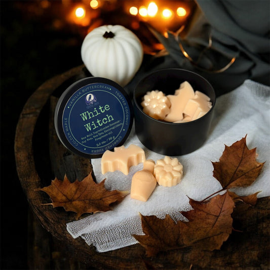 Dark witchy background with wax melts on witch altar with dried leaves
