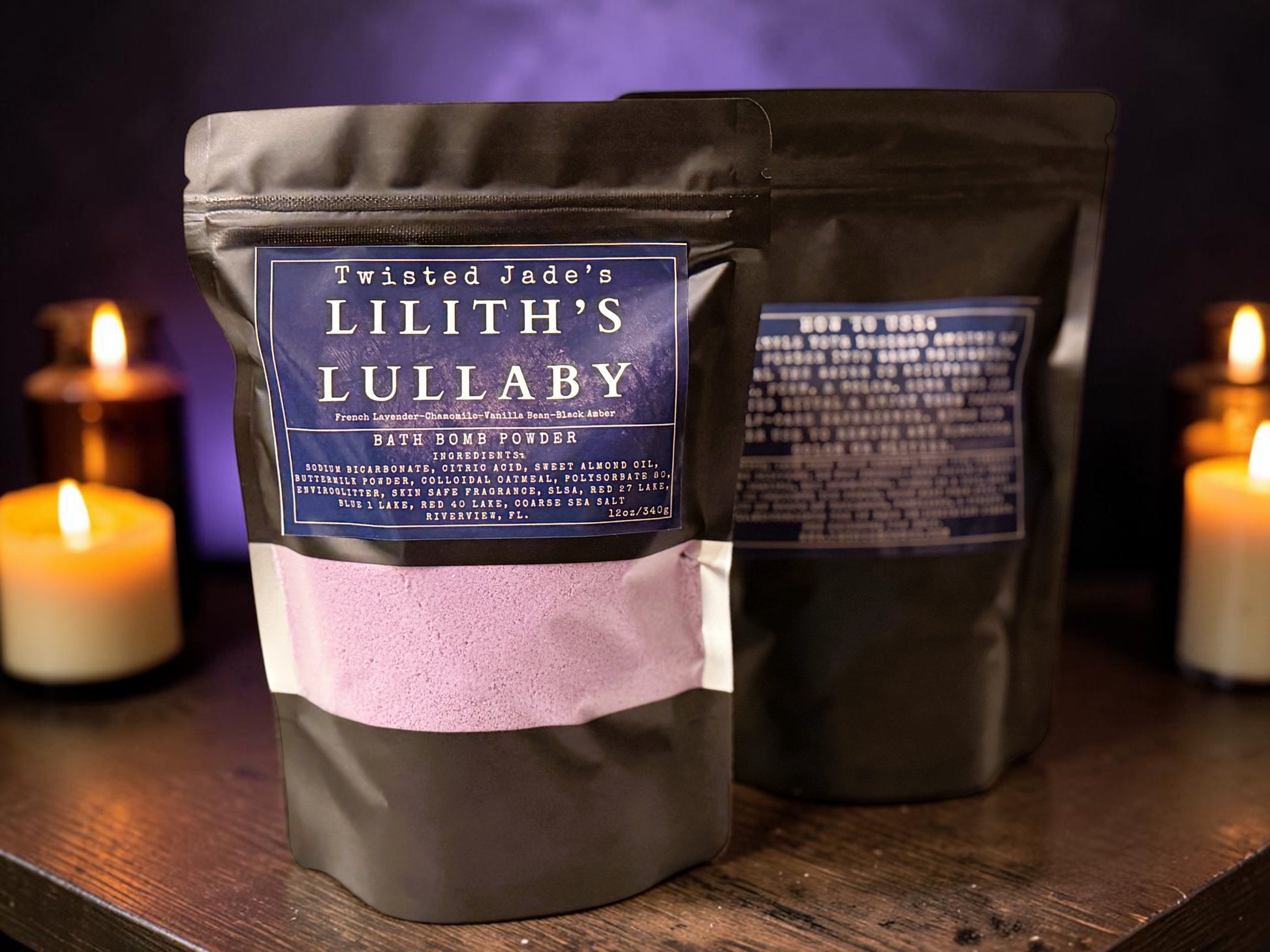 Twisted Jade's Lilith's Lullaby bath bomb powder in a black pouch with purple powder. Scented with chamomile, lavender, vanilla, and black amber.